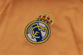 Camisa Real Madrid 2025/26 Edição Polo - Laranja - Versão Torcedor